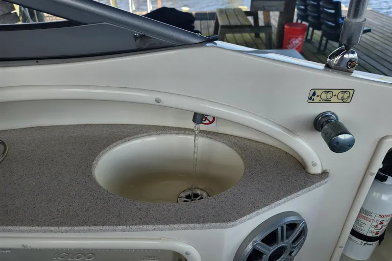 Slide: The Image of 2018 Stingray 235 LR boat sink with running water and control knob. - 50