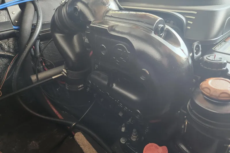 Slide: The Image of Engine compartment of a 2018 Stingray 235 LR boat, showcasing detailed components. - 62