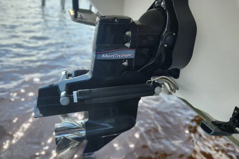 Slide: The Image of 2018 Stingray 235 LR boat with MerCruiser engine, close-up view. - 76