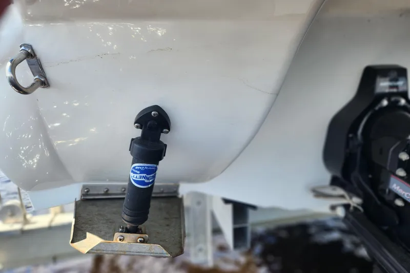 Slide: The Image of 2018 Stingray 235 LR boat stern with trim tab and hydraulic actuator. - 82