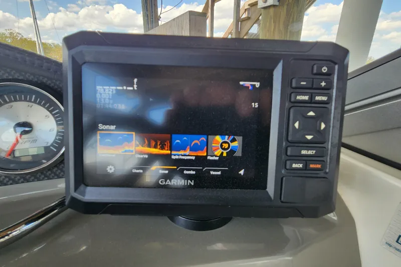 Slide: The Image of Garmin sonar display on 2018 Stingray 235 LR boat dashboard, showing navigation and sonar options. - 85