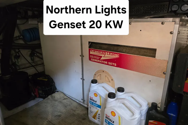 Slide: The Image of Northern Lights 20 KW generator with Shell Rotella oil containers, President 58, 1996 model. - 17