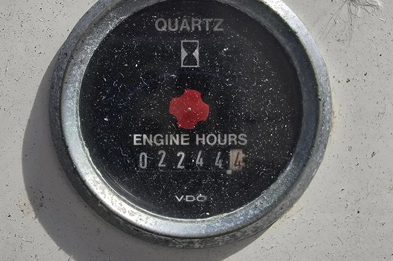 Slide: The Image of Quartz engine hour meter showing 2244.4 hours on a 1996 President 58 model. - 19