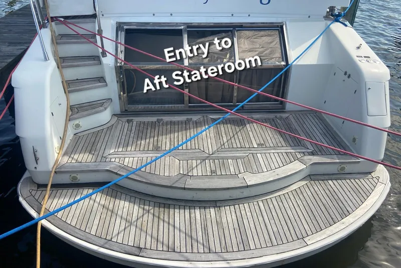 Slide: The Image of Aft stateroom entry on 1996 President 58 yacht with wooden deck and steps. - 39