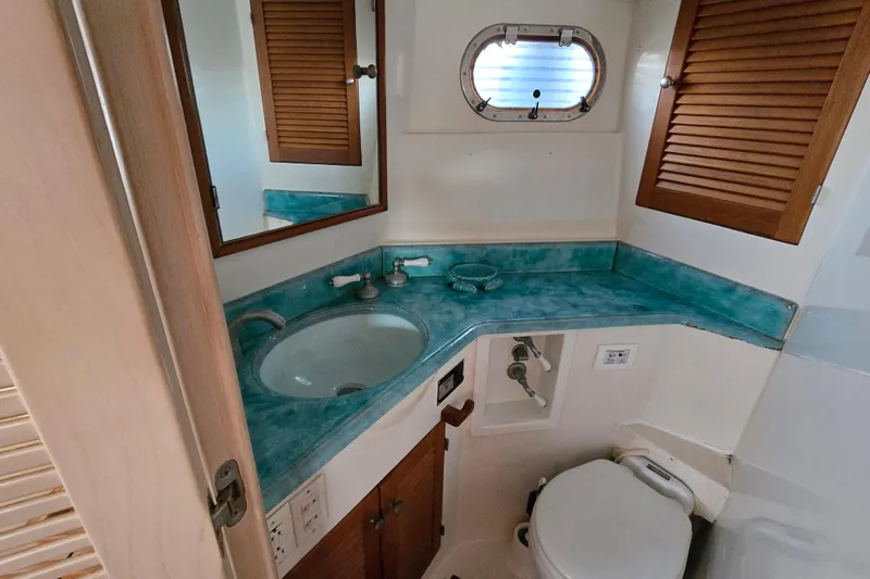 Slide: The Image of Bathroom interior of a 1996 President 58 yacht with turquoise countertop. - 40