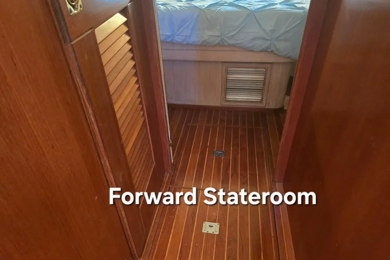 Slide: The Image of Forward stateroom with wooden flooring in 1996 President 58 yacht. - 46