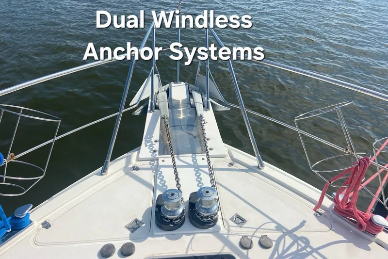 Slide: The Image of Dual windless anchor systems on 1996 President 58 yacht, featuring sturdy chains and railing. - 5