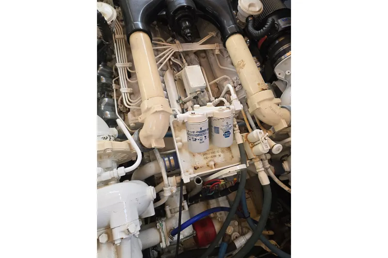 Slide: The Image of Engine components of a 1996 President 58 model, showcasing intricate mechanical details. - 62