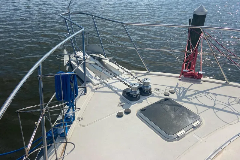 Slide: The Image of Bow of 1996 President 58 yacht with anchor chains and ropes. - 68