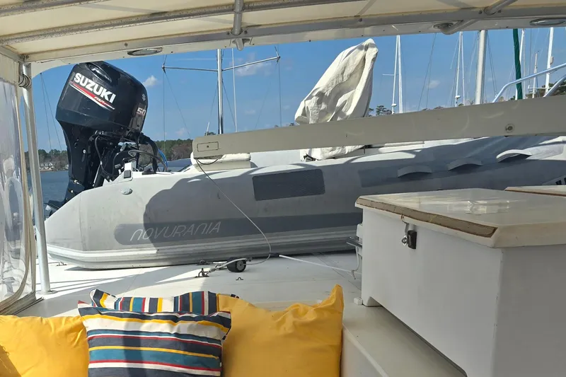 Slide: The Image of Cozy boat interior with colorful cushions, Suzuki outboard motor, and Novurania inflatable boat. - 9