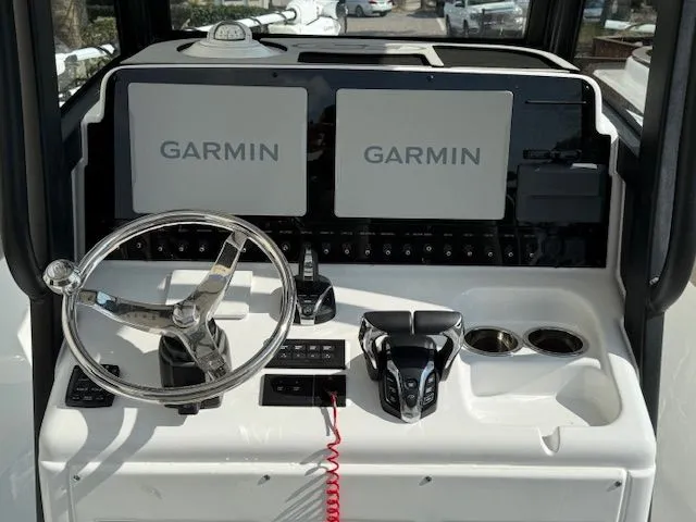 Slide: The Image of Sea Hunt Ultra 265 SE 2025 helm with Garmin displays. - 10