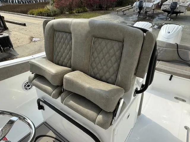 Slide: The Image of 2025 Sea Hunt Ultra 265 SE seating with diamond-pattern upholstery. - 23