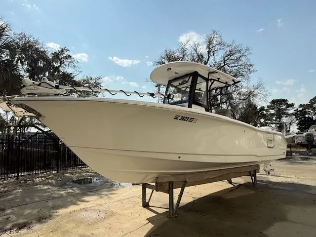 Slide: The Image of 2025 Sea Hunt Ultra 265 SE boat on a dock. - 3