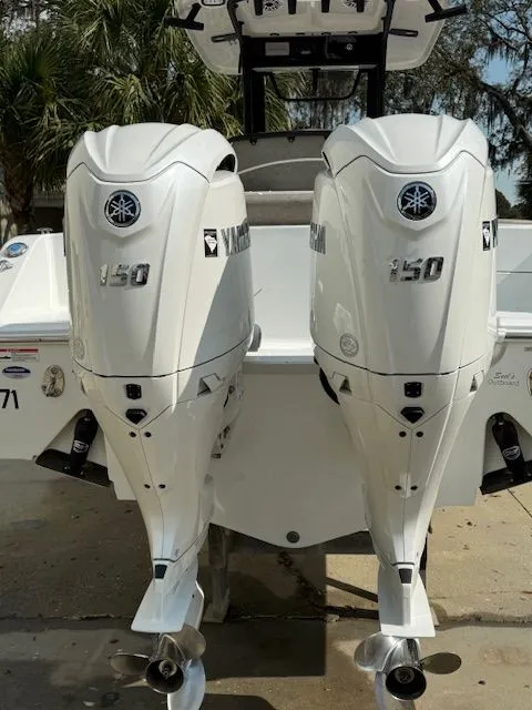 Slide: The Image of Two Yamaha 150 outboard motors on a Sea Hunt Ultra 265 SE boat. - 4