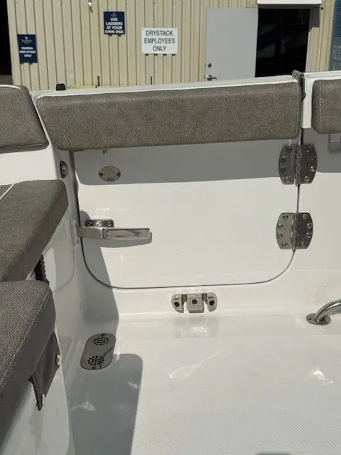 Slide: The Image of Interior view of 2025 Sea Hunt Ultra 265 SE with gray upholstery. - 9