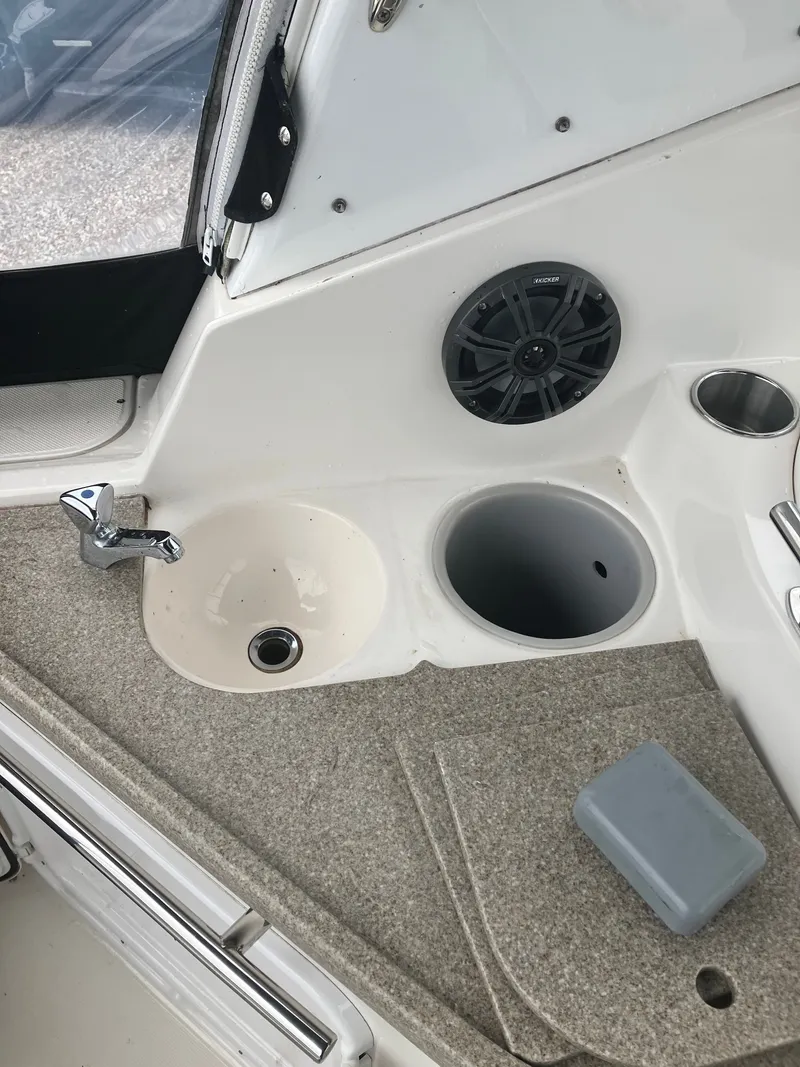 Slide: The Image of Interior of 2008 Rinker 260 Express Cruiser with sink and speaker. - 11