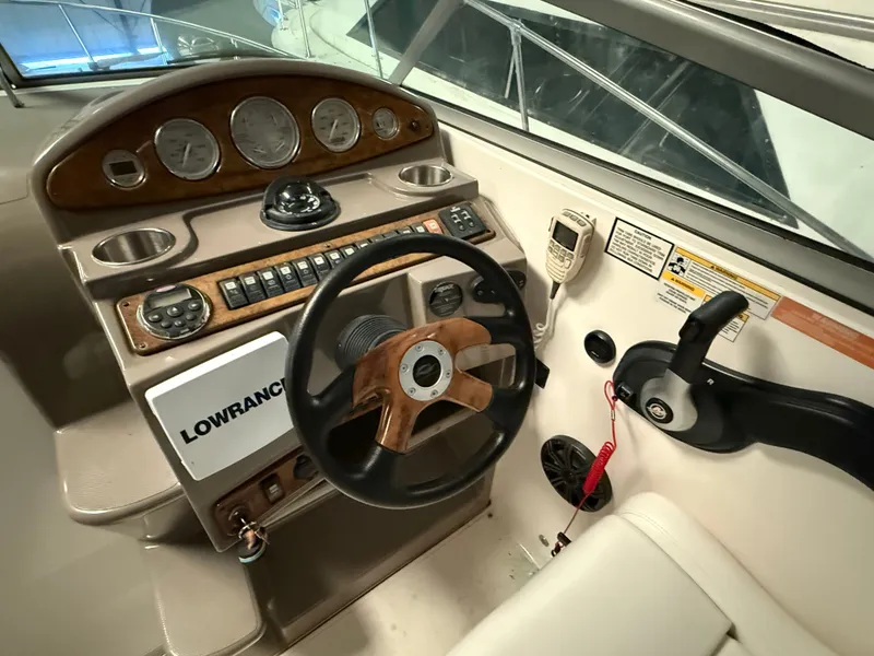 Slide: The Image of 2008 Rinker 260 Express Cruiser helm with instruments. - 14
