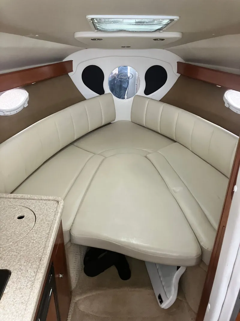 Slide: The Image of Interior of 2008 Rinker 260 Express Cruiser with beige upholstery. - 3