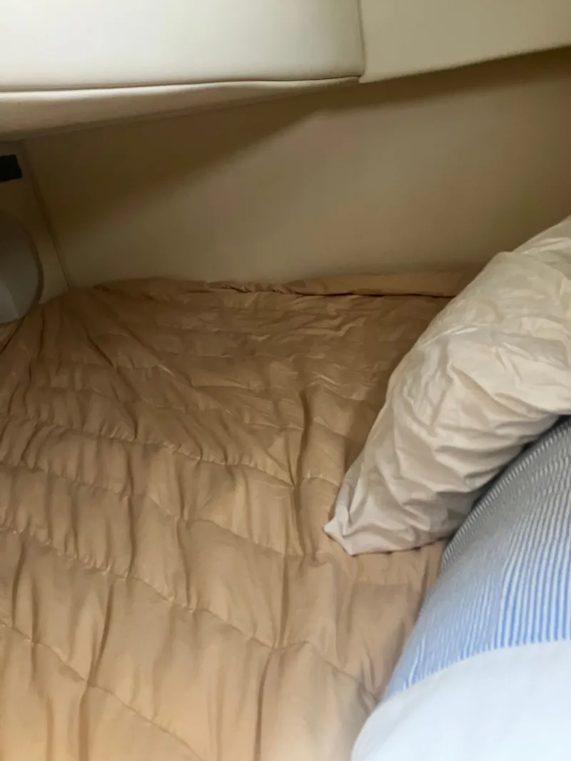 Slide: The Image of Interior of 2008 Rinker 260 Express Cruiser with bed. - 6