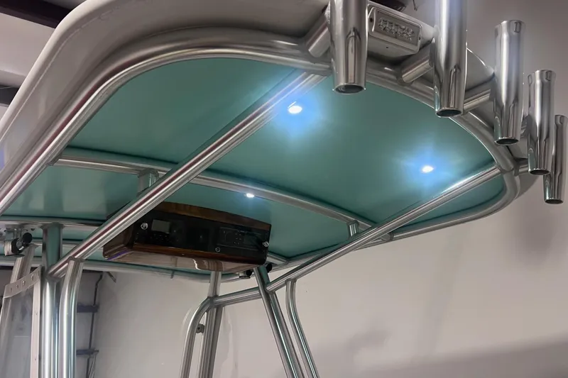 Slide: The Image of 2017 Harrison Boatworks 28 Center Console T-top with rod holders and LED lights. - 18