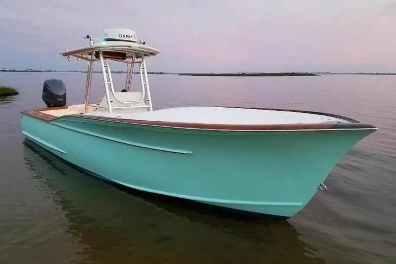 Slide: The Image of 2017 Harrison Boatworks 28 Center Console in calm waters at sunset. - 3