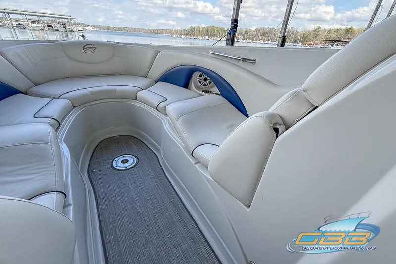 Slide: The Image of 2009 Crownline 300 LS boat interior with white seating and lake view. - 15