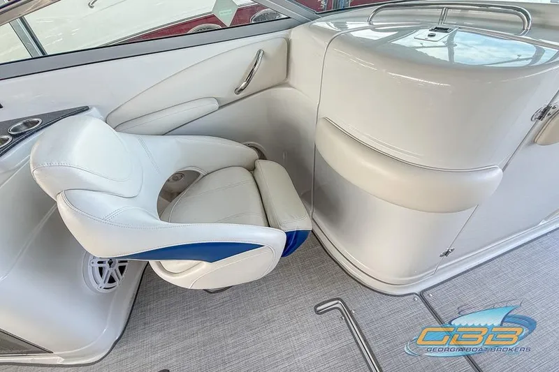 Slide: The Image of 2009 Crownline 300 LS boat interior with white seating and modern design. - 16