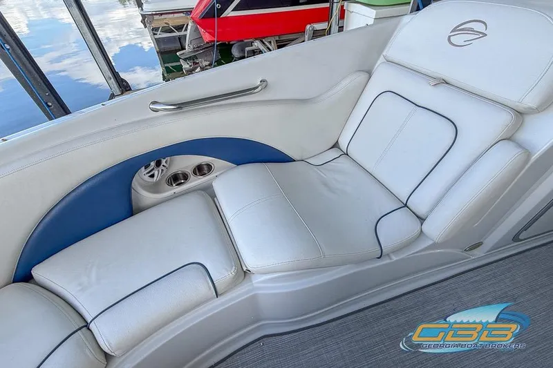 Slide: The Image of Luxurious seating on 2009 Crownline 300 LS boat with cup holders and elegant design. - 19