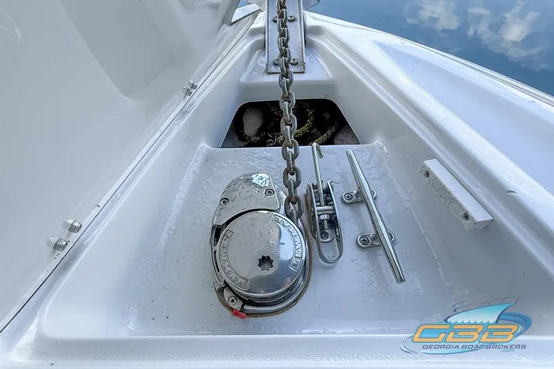 Slide: The Image of 2009 Crownline 300 LS boat anchor system with chain and cleats, Georgia Boat Brokers logo. - 21