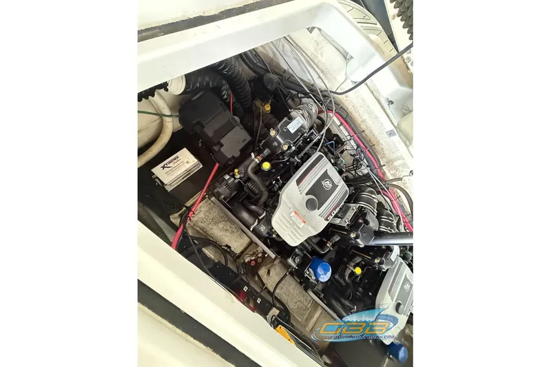 Slide: The Image of Engine compartment of a 2009 Crownline 300 LS boat, showcasing detailed mechanical components. - 24