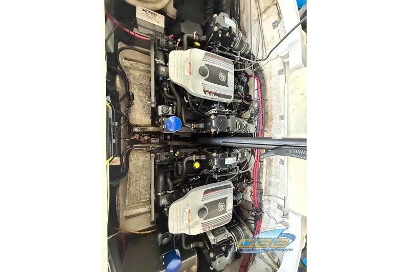 Slide: The Image of 2009 Crownline 300 LS boat engine compartment with dual engines, detailed view. - 26