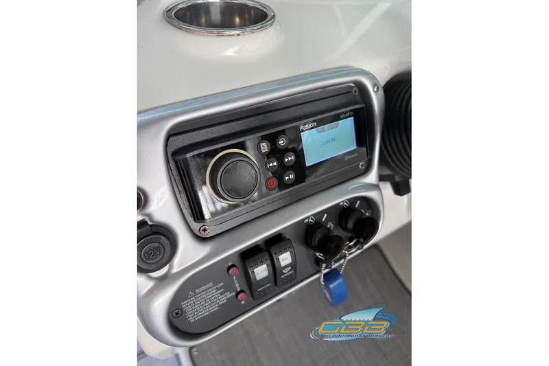 Slide: The Image of 2009 Crownline 300 LS boat dashboard with Fusion stereo system and controls. - 29