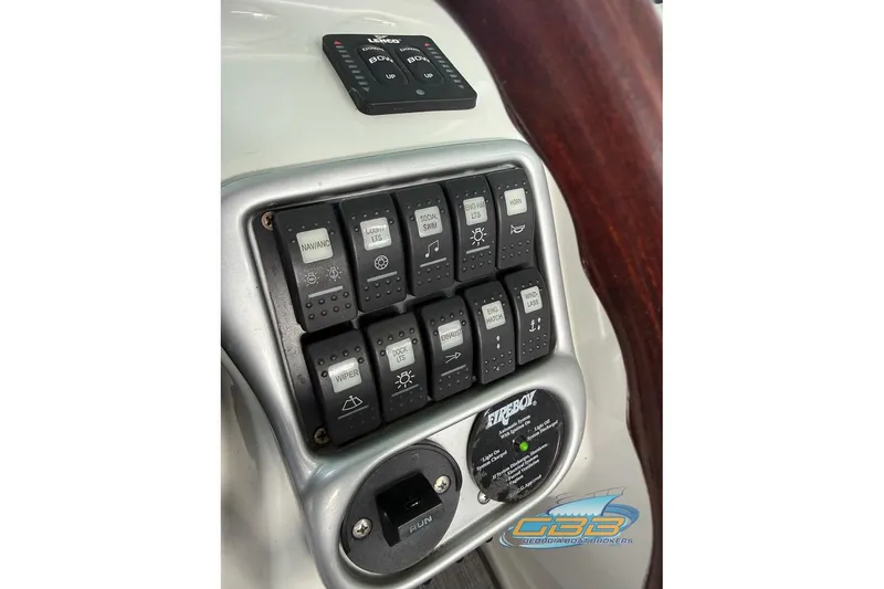 Slide: The Image of Control panel of a 2009 Crownline 300 LS boat with various switches and indicators. - 30