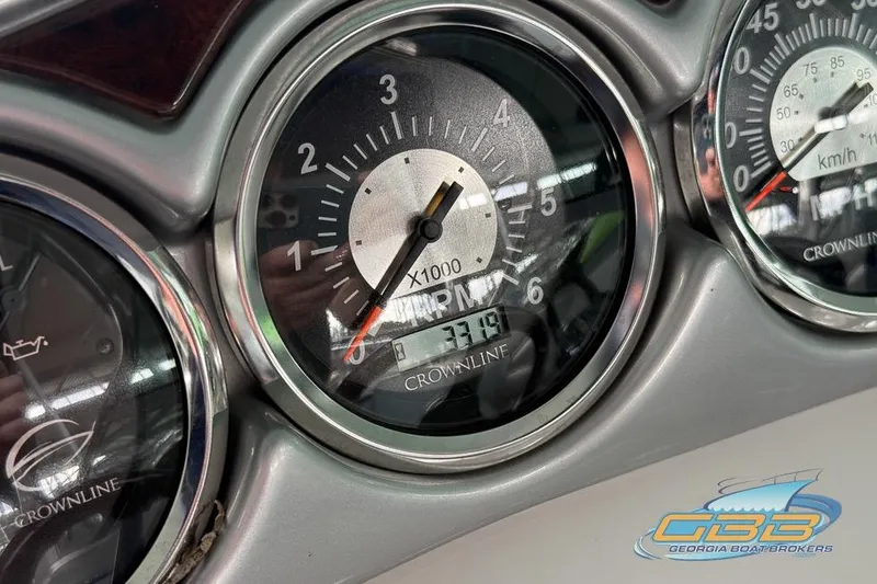 Slide: The Image of Close-up of 2009 Crownline 300 LS boat dashboard gauges. - 32