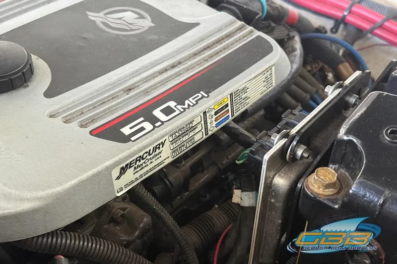 Slide: The Image of 2009 Crownline 300 LS boat engine, featuring a 5.0 MPI Mercury MerCruiser. - 34