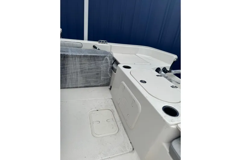 Slide: The Image of 2026 Carolina Skiff 21 LS boat interior with storage compartments and seating. - 3