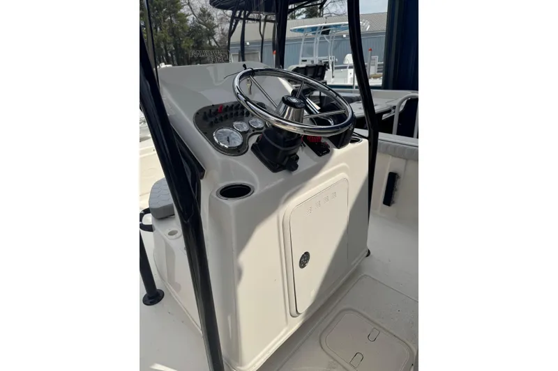 Slide: The Image of 2026 Carolina Skiff 21 LS boat console with steering wheel and gauges. - 8