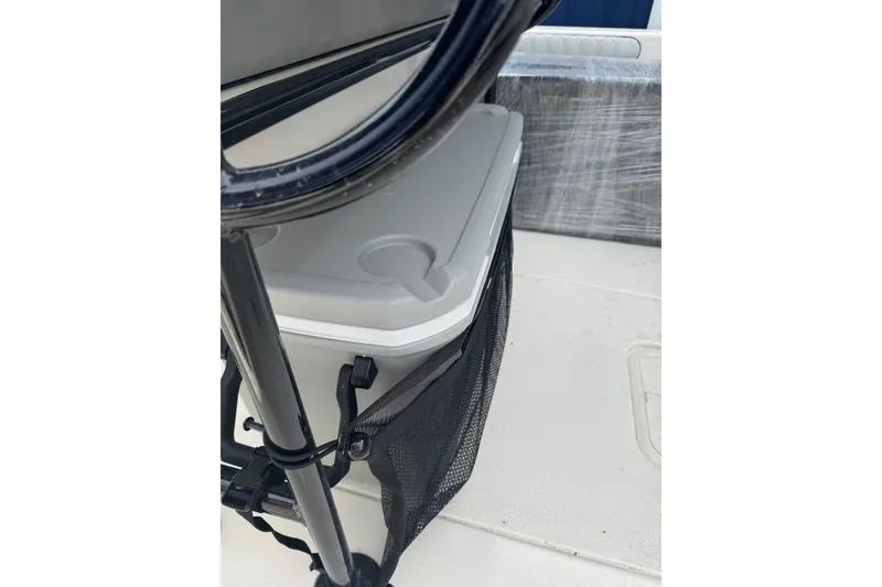 Slide: The Image of 2026 Carolina Skiff 21 LS boat interior with storage compartment and netting. - 9