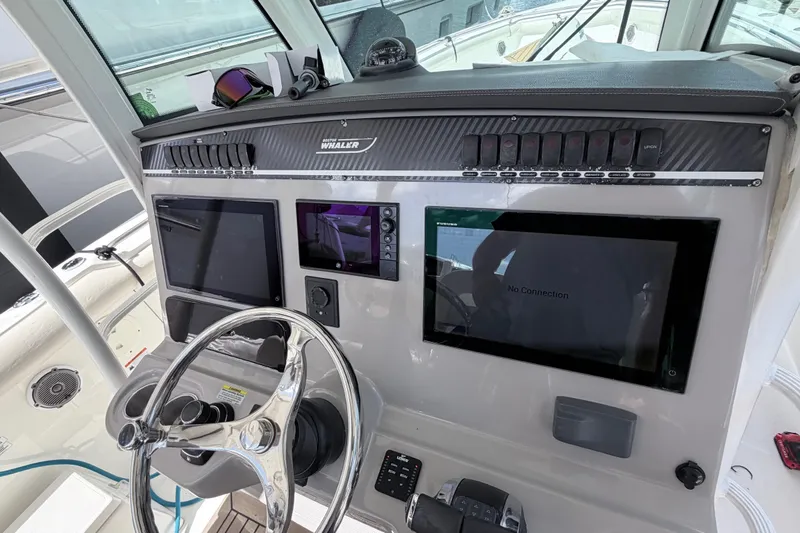 Slide: The Image of 2017 Boston Whaler 350 Outrage helm with modern navigation and control systems. - 10