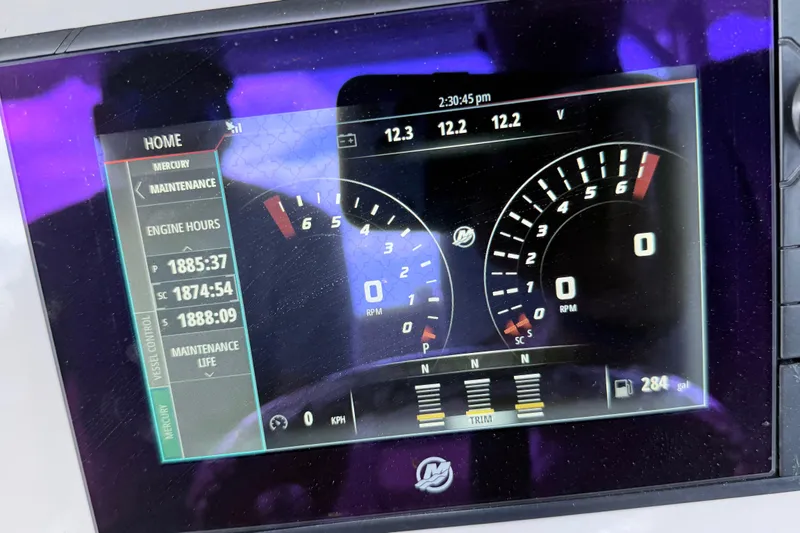 Slide: The Image of Dashboard display of a 2017 Boston Whaler 350 Outrage showing engine hours and RPM gauges. - 9