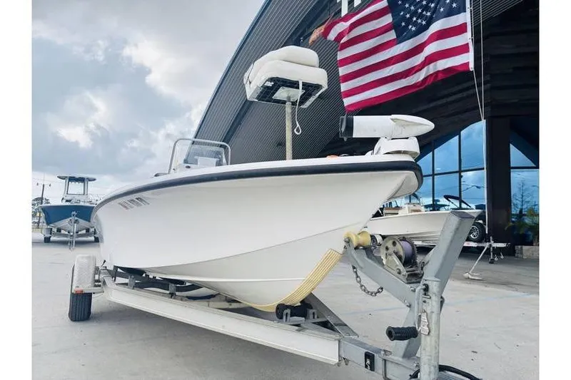 Slide: The Image of 2008 Kenner Vision 1800 boat on trailer, American flag in background. - 3