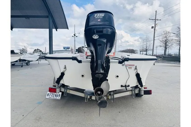 Slide: The Image of Kenner Vision 1800 boat, 2008 model, with outboard motor on trailer. - 9