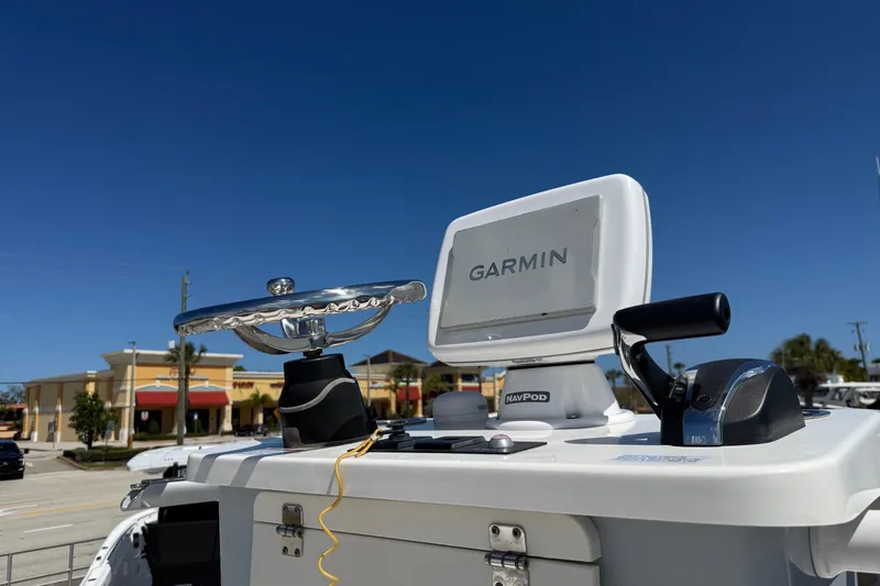 Slide: The Image of 2023 Robalo 246 Cayman SD boat dashboard with Garmin navigation system. - 7