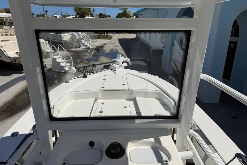 Slide: The Image of 2023 Robalo 246 Cayman SD boat interior view through windshield. - 9