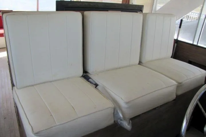 Slide: The Image of White cushioned seating on a 1973 Chris-Craft 55 Commander yacht. - 16
