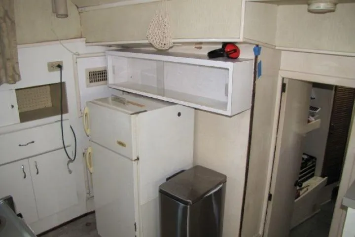 Slide: The Image of Interior of 1973 Chris-Craft 55 Commander yacht kitchen with vintage appliances. - 29
