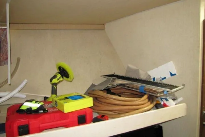 Slide: The Image of Shelf with tools and supplies on a 1973 Chris-Craft 55 Commander boat. - 33