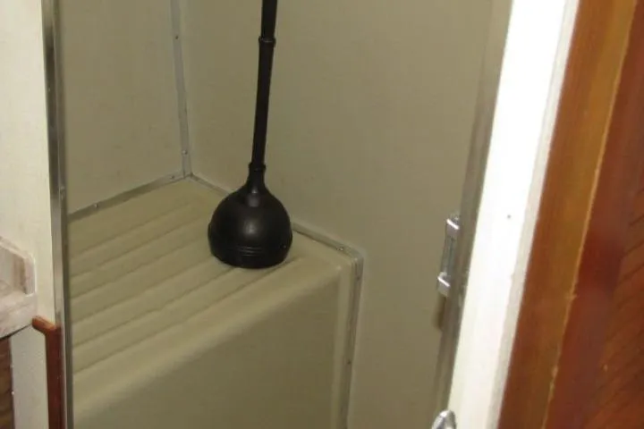 Slide: The Image of Small bathroom area on a 1973 Chris-Craft 55 Commander yacht. - 36