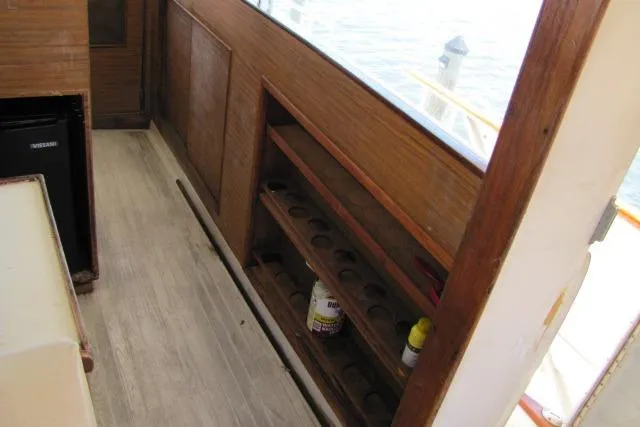 Slide: The Image of Interior of 1973 Chris-Craft 55 Commander with wooden shelves and flooring. - 65