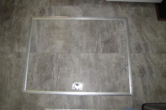 Slide: The Image of Aluminum frame on tiled floor, possibly from a 1973 Chris-Craft 55 Commander. - 71